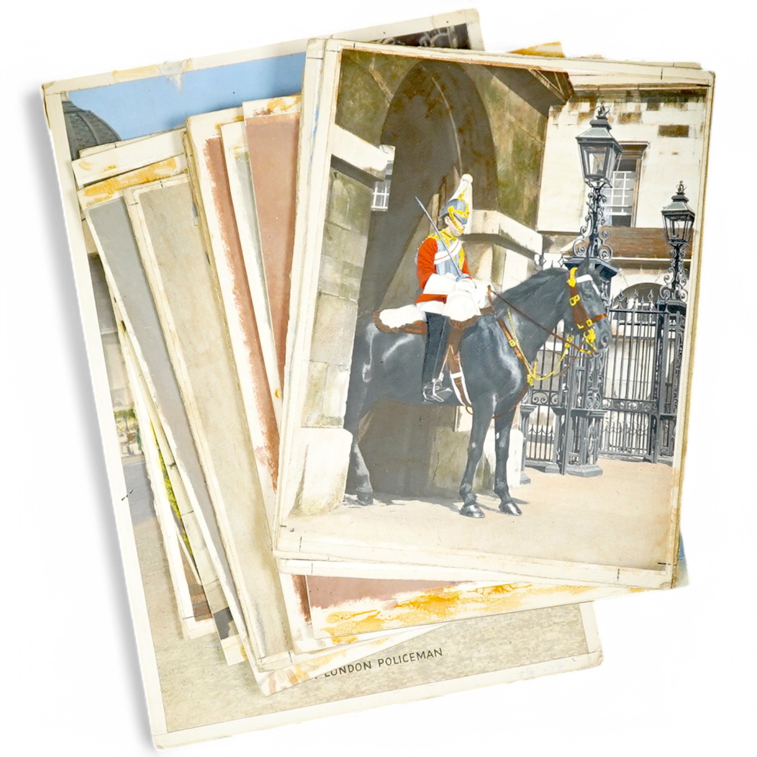 A set of thirteen original hand coloured photographs for postcards, London Pageantry scenes to include Changing the guard at Buckingham Palace, Lifeguards in the mall, and Yeoman warders at St James Palace, unframed, lar